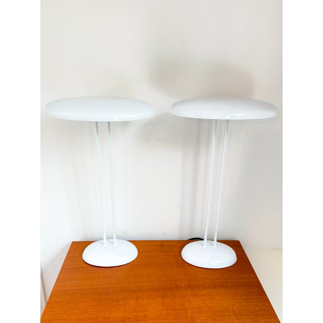 A pair of white metal ufo table lamps by brilliant, most likely dating from the 1970s, with oval shades and matching oval...