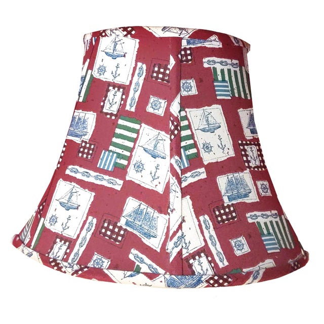 Bell shaped lampshade covered in a charming 70s nautical themed textile featuring a printed patchwork of various items...