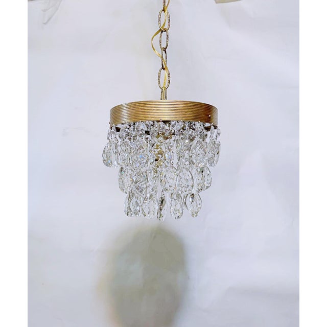 Add a touch of timeless glamour to your interior with this stunning vintage crystals chandelier. Featuring an elegant...