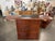 This Chinese bar cabinet features a pair of doors that open to reveal a beautiful setup of storage compartments for drinks...