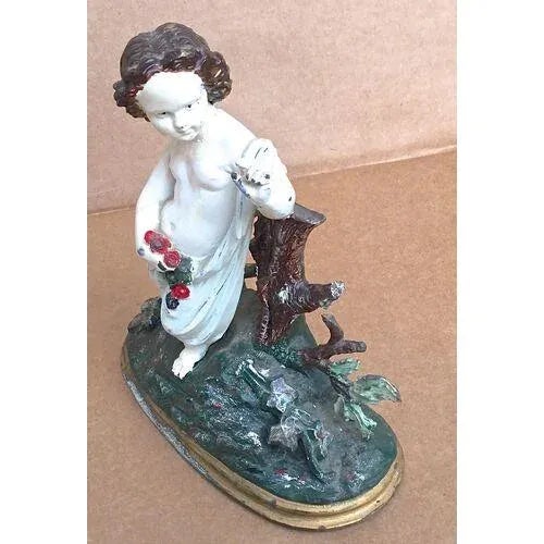 Antique painted cast iron cherub with flowers set in a bucolic country scene against a tree stump. Would make a lovely...
