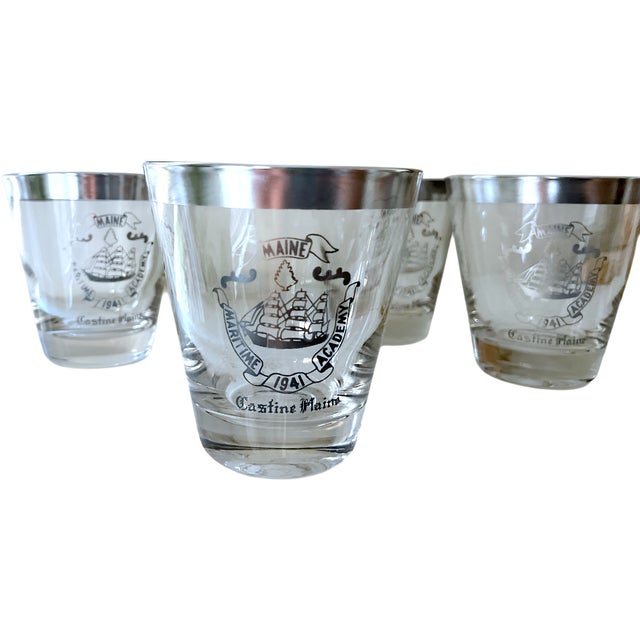 A classic set of four vintage cocktail glasses featuring the crest of the Maine Maritime Academy (est. 1941) and “Castine,...
