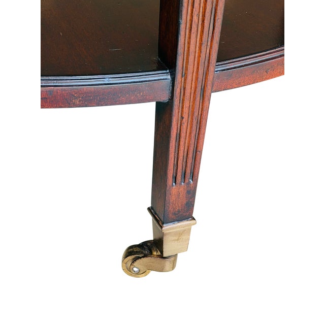Vintage Mahogany Two-Tier Side Table | Bookmatched Starburst Top | Fluted Legs | Brass Caster Feet For Sale - Image 9 of 11