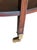Vintage Mahogany Two-Tier Side Table | Bookmatched Starburst Top | Fluted Legs | Brass Caster Feet For Sale - Image 9 of 11