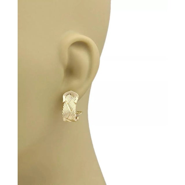 Brand: Cartier Collection: Neptune Style: Double C Basket Weave Earrings Material: 18k yellow gold Design: Basket weave...