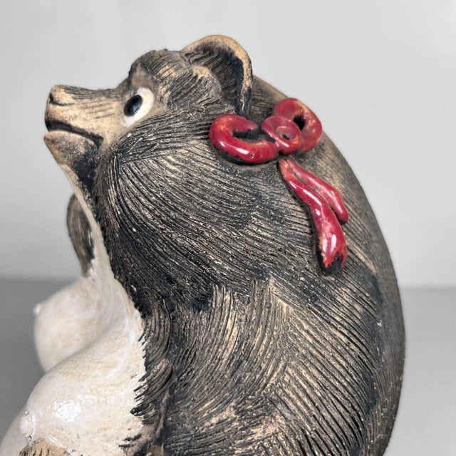 Charming and characterful Tanuki statue from the 1960s, crafted from authentic Shigaraki pottery. Dimensions: height 30...