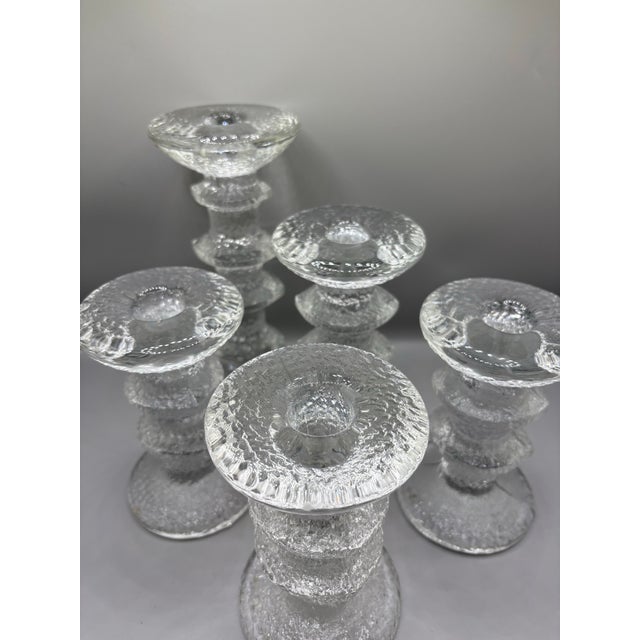 Set of five Iittala Festivo glass candle holders. 3 x 2 rung 5” 1 x 3 rung 5.5” 1 x 4 rung 7” Excellent condition.