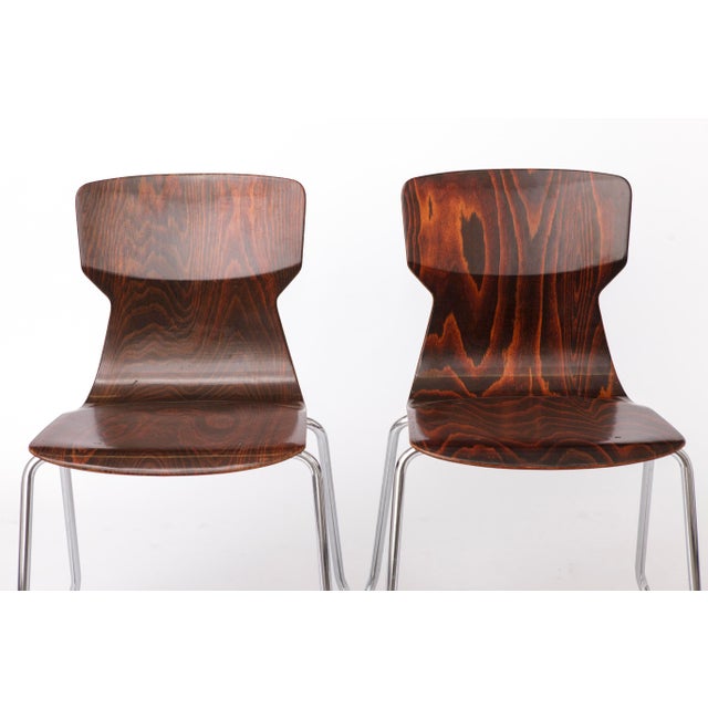 2 of 8 Vintage Stackable Chairs by Casala | Germany, 1970s Two chairs from a set of eight vintage stackable chairs...