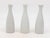 Each single white ceramic vase, crafted in early 21st century France, is part of a set of three, with multiple sets...