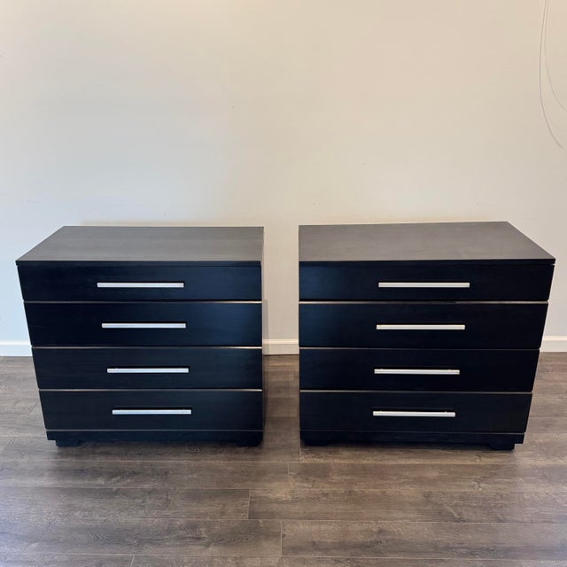 This is a pair of bachelor’s chest designed by Raymond Loewy for Mengel Furniture. They are ebony lacquered oak with a...