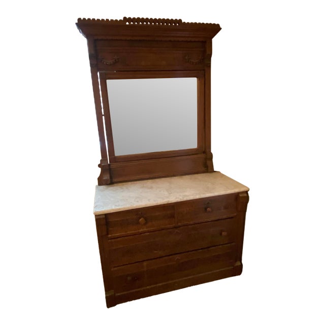 Late 19th Century Victorian Eastlake Style Dresser With Marble Top and Attached Mirror For Sale