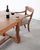 A robust mid-20th century oak farmhouse trestle harvest dining table with solid oak construction in a classic French...