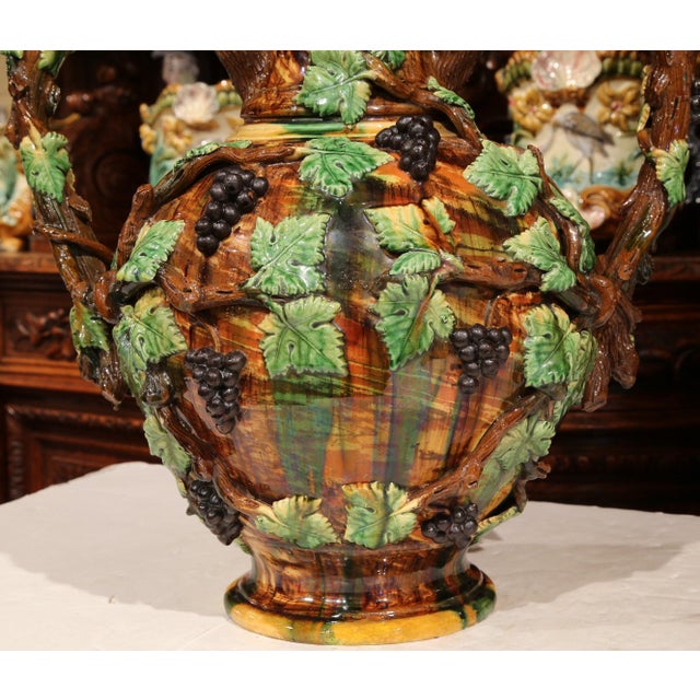 This striking antique, hand-painted ceramic amphora was crafted in France circa 1890, and its scale and sculptural...