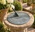 A classic vintage iron verdigris garden sundial inspired by traditional English estate landscapes, reading "Grow old along...