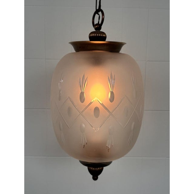 Vintage pendant lamp, dating approximately to the 1960s. Lantern (or bowl) lampshade in frosted glass. Geometric...