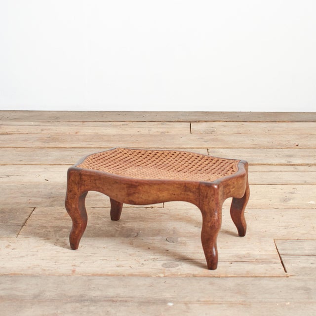 Small Antique French Cane Foot Stool A beautiful French walnut foot stool with cane seat and lovely curved legs. A great...
