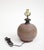 Artist signed stoneware pottery table lamp, 20th century. Spherical pottery lamp base with cut-in design to the clay, in a...