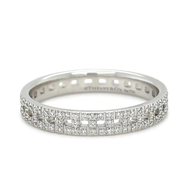 A modern and sophisticated Tiffany & Co. T True narrow pavé diamond ring crafted in 18ct white gold, featuring the...