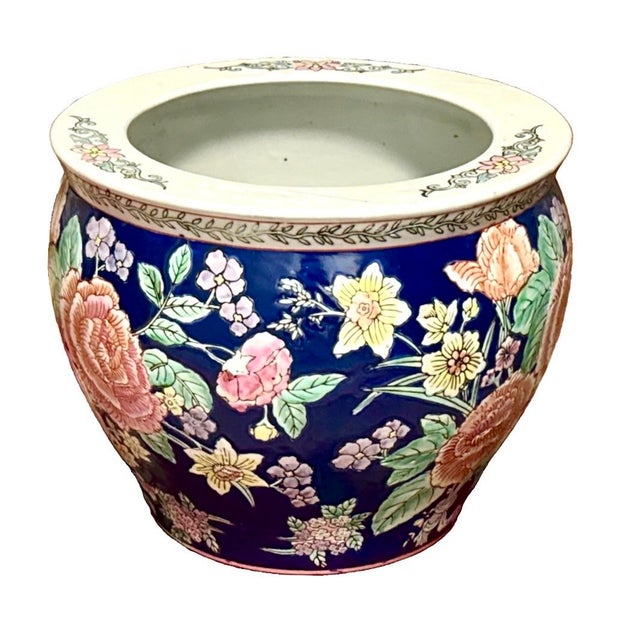 Vintage Chinese porcelain fishbowl planter featuring a deep cobalt blue background with hand-painted pink and yellow...