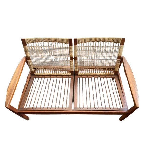 Striking 2-seater sofa designed by Hans Olsen for Juul Kristensen in Denmark circa 1960s. This stylish design features a...