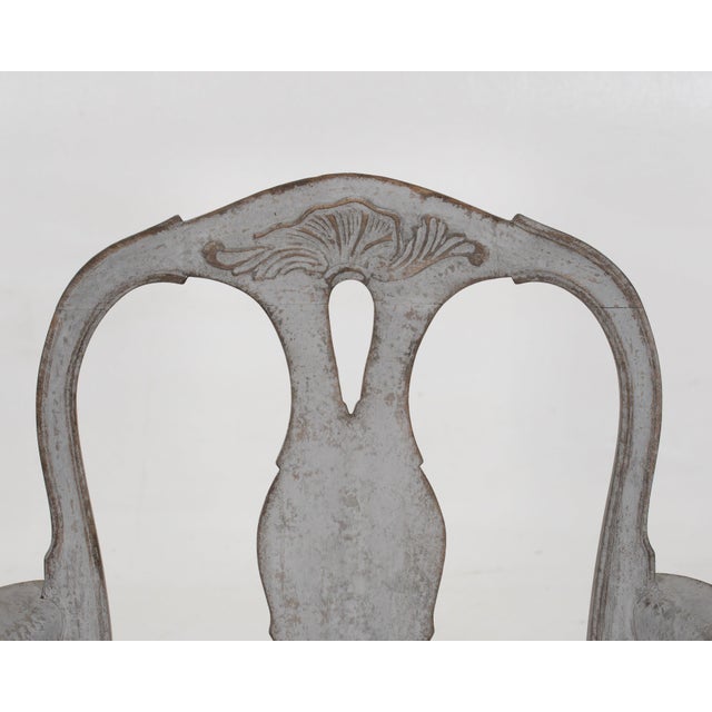 This 19th century swedish armchair displays exquisite carvings and a gorgeous patina. h. 94 h-seat. 42 w. 62 d. 48 cm h....