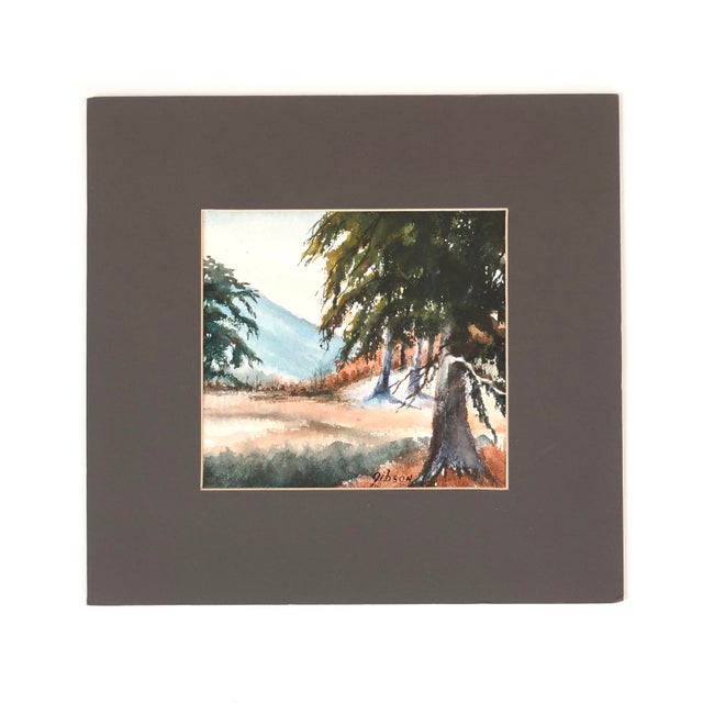 This original watercolor painting on paper presents a compact landscape scene composed of layered washes and controlled...