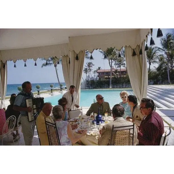 Dining at Wilmot’s 1968 Accordion music accompanies a meal by the pool at the home of Molly Wilmot in Palm Beach, Florida,...