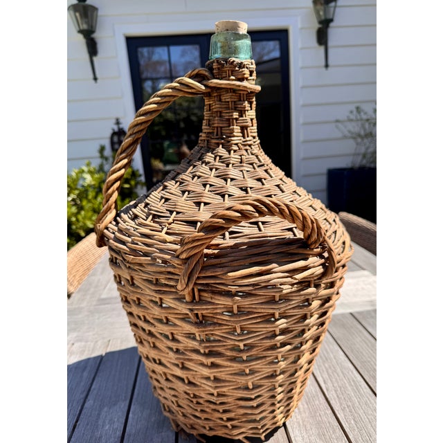 Antique French Wicker Demijohn – Vintage Glass Bottle with Woven Basket Bring a touch of rustic French elegance to your...