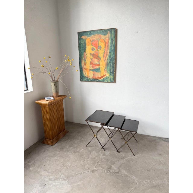 Set of three nesting tables, in the style of jacques adnet or maison jansen from the 1950s. each table has a cross-shaped...