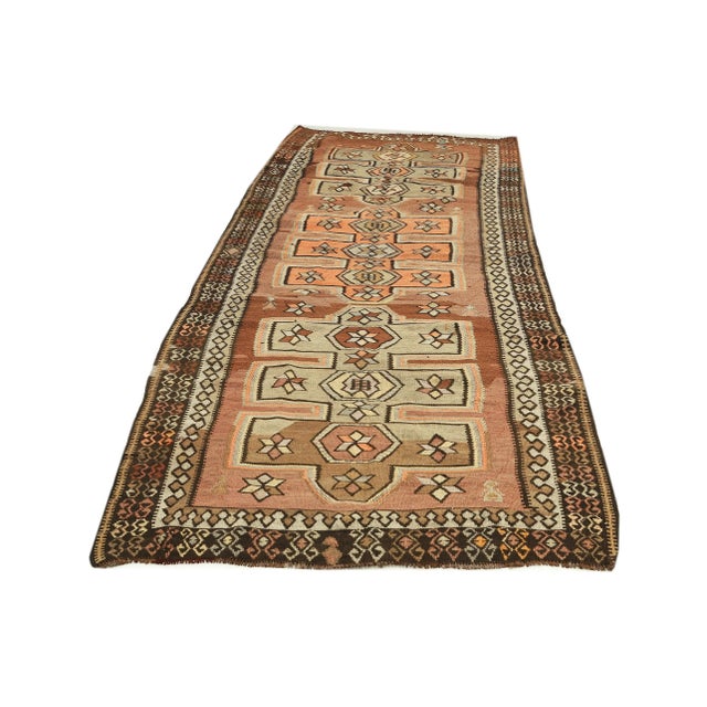 Decorative handwoven vintage kilim rug from Kars region of Turkey. Approximately 50-60 years old. In very good condition.