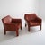 c. 1970s, signed. There is considerable wear and patina but both chairs present well and are very comfortable. There is a...