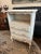 Beautiful French Country style painted three drawer nightstand / occasional cabinet, featuring three drawers, and a cubby...
