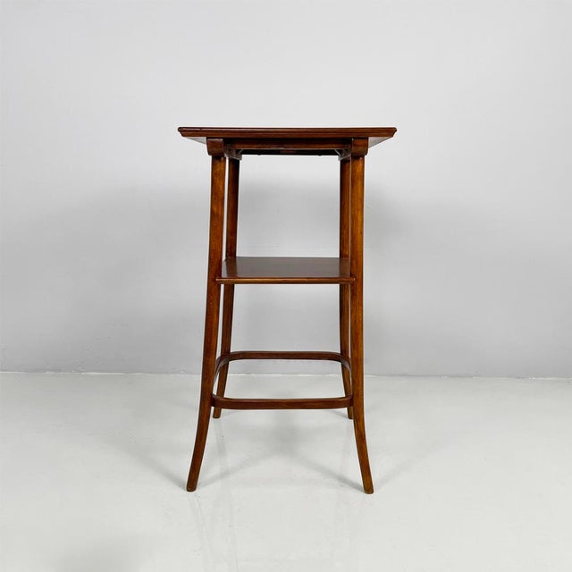 Italian art deco square wooden pedestal, 1920s Pedestal or display column with a square wooden top. The top is supported...