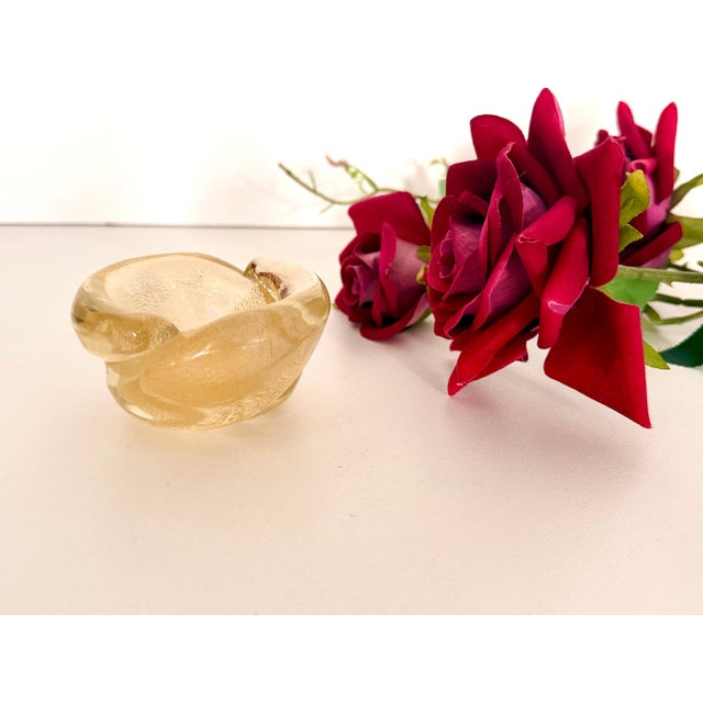 Made in Italy, 1950s, in the style of Archimede Seguso. It is in thick clear Murano glass with gold leaf. This is a...