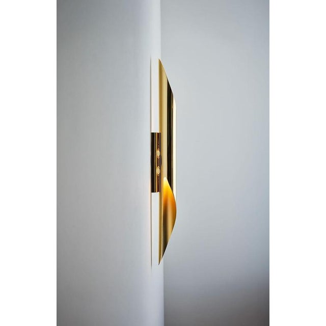 Ruban wall lamp by jennifer midoz dimensions: d 6 x w 8,5 x h 70 cm materials: pale gold on polished and sandblasted...