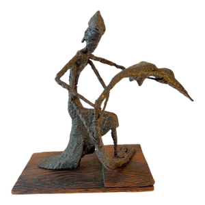 Figurative Sculpture Mounted on Wood in the Style of Giacometti