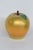 This brilliant Apple Paperweight is made of art glass. This beautiful sculptural apple presents an iridescent gold color...