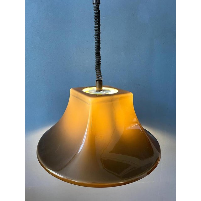 Amazing acrylic glass witch hat pendant lamp by Willem Hagoort. The design comes into its own with the playful combination...