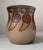 A stylish vase executed in hand-painted terracotta. Decorated in earthy glazes with snails circling around its perimeter....