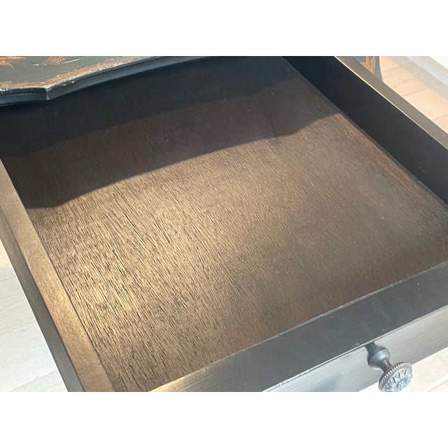 Beautiful Michael Taylor Black Pavillion Side Table with Drawer. Golden floral designs are throughout the piece. On the...