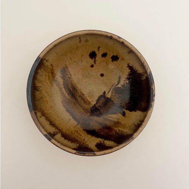 Beautiful handcrafted ceramic bowl. Abstract design in shades of tan & brown. Artist signed and dated.