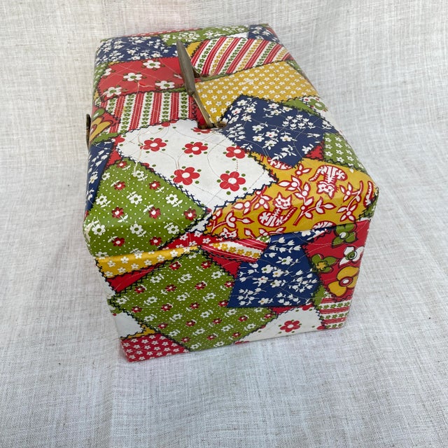 A pretty retro and funky faux patchwork sewing box. The cover is vinyl. It shows some signs of wear in the vinyl, a few...