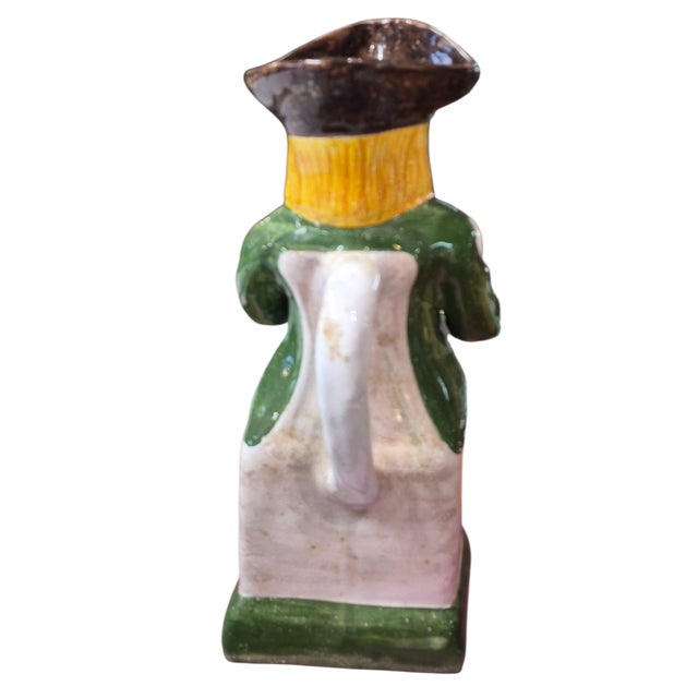 A 20th c Portuguese Majolica Toby Jug Pitcher in wonderful tones of green and yellow. Made in the old style, this pitcher...