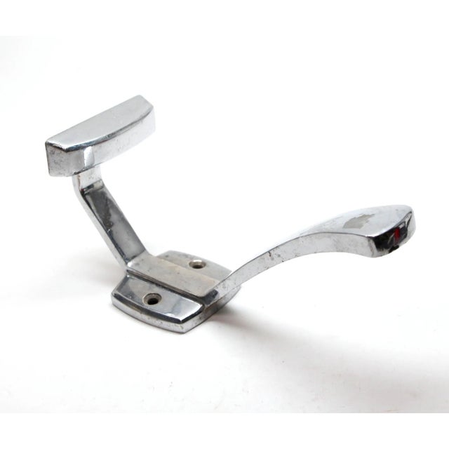 A French style vintage European double arm wall hook made of chrome over aluminum. The original mounting screws are not...