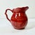 We absolutely love the handle on this pretty deep ruby red hand-painted ceramic Pitcher. The unique shape of curves and...