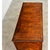 This Italian chest of drawers from the 19th century, in its wide, rectilinear proportions becomes a showcase for the...