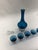 Elevate your bar cart or display with this striking Mid-Century Modern cobalt blue glass decanter and matching set of five...