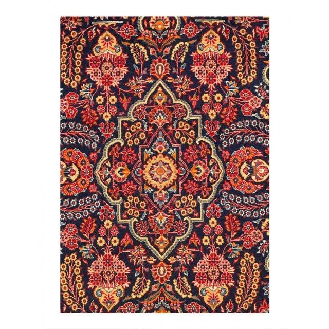 A lush array of spiraling vines, palmettes, and flowering plants repeats in rhythmic symmetry across the soft red field of...