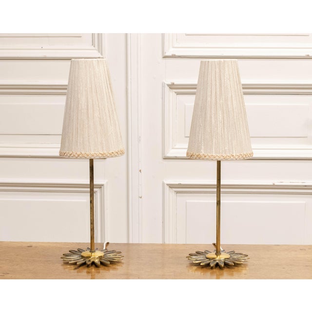 Elegant pair of 1950s Swedish mantel or table lamps, crafted in brass and featuring beautifully detailed “sunburst” bases....