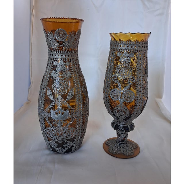 An exceptional and decorative pair of late 19th-to-early 20th-century Bohemian amber glass decorative vessels encased in...